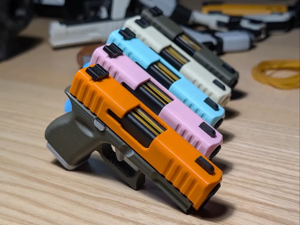 Porte-clés Fidget Pistolet Rétractable